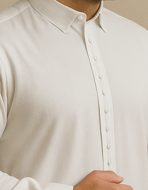 Close-up of a white button-up shirt with a neutral background