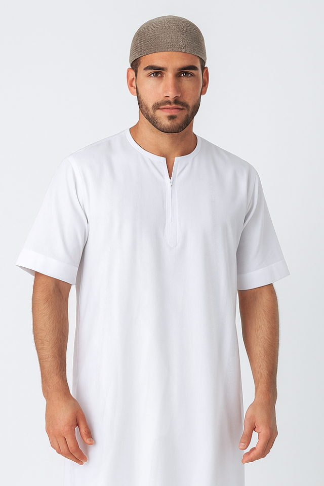 Man wearing a white thobe with a brown headscarf on a white background