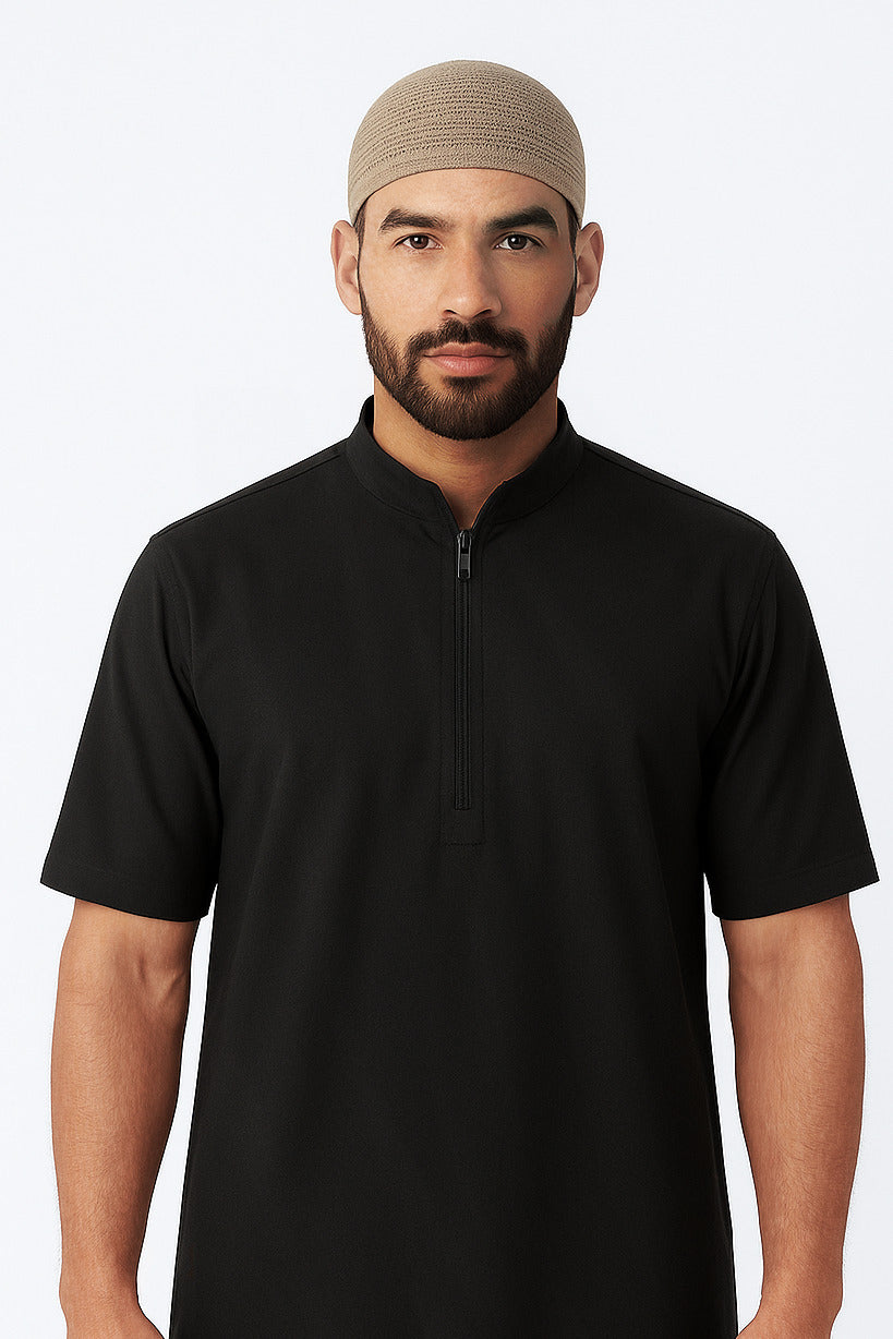 Man wearing a black short-sleeve shirt with a zipper on a white background