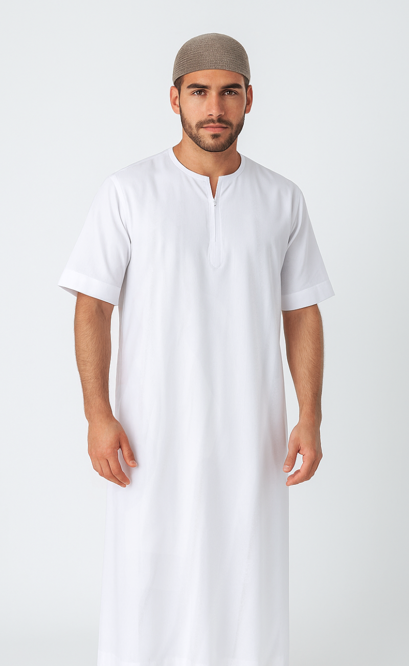 Man wearing a white thobe and beige cap on a white background